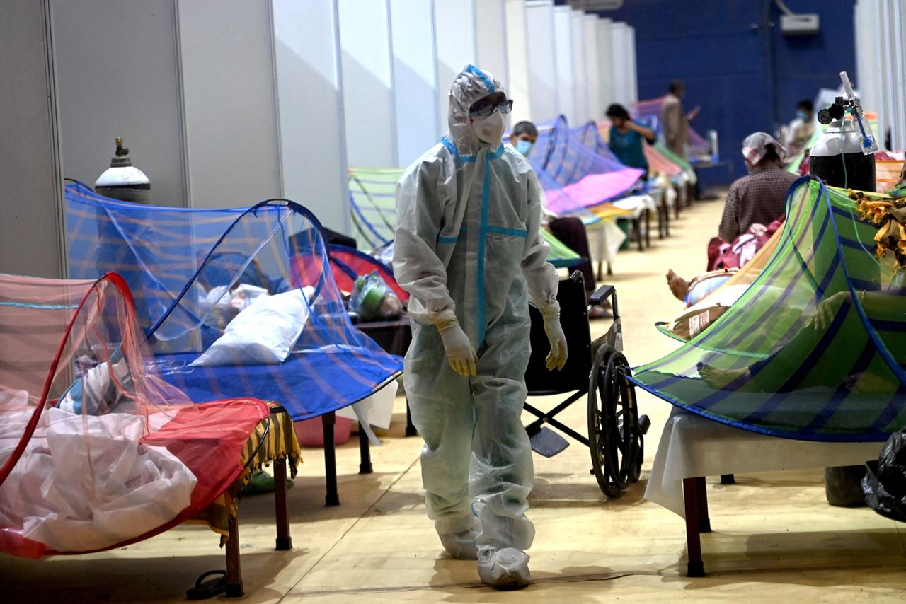 A health worker walks inside the Commonwealth Games stadium temporarily converted into a Covid-19 care center in New Delhi, India, on May 5.