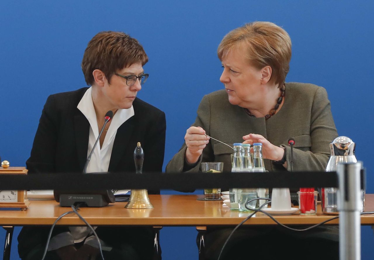 The leader of the Christian Democratic Union (CDU) Annegret Kramp-Karrenbauer, left, speaks with German Chancellor Angela Merkel, prior to a party leadership meeting on February 24, in Berlin, Germany.