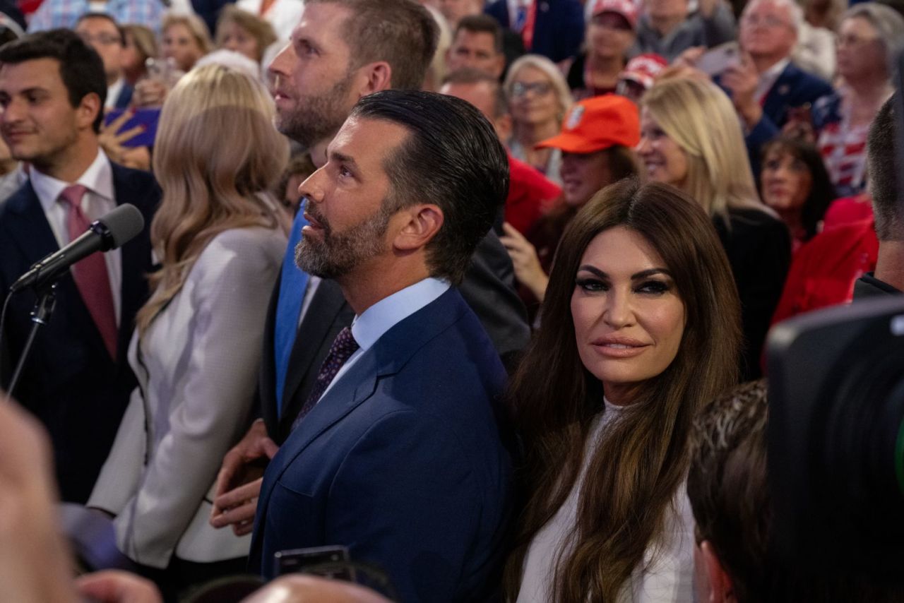 Former President Donald Trump's sons Eric, center left, and Donald Jr. attend the convention on Monday.