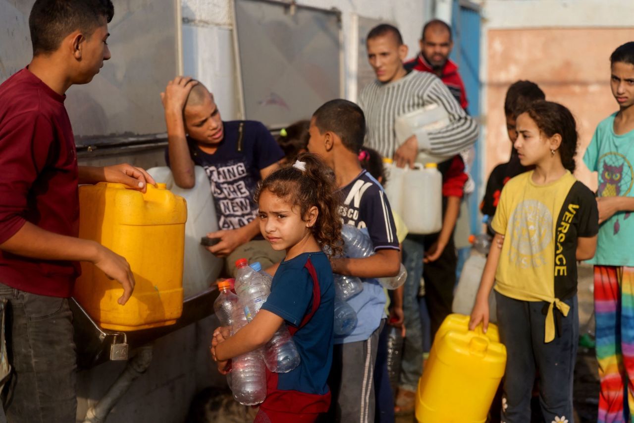 Palestinians line up to refill their water containers in Rafah, southern Gaza, on Tuesday.