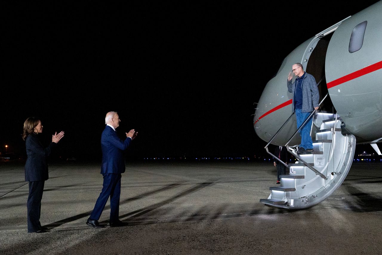 From left, US Vice President Kamala Harris and President Joe Biden greet Whelan upon his arrival at Joint Base Andrews in Maryland on Thursday.