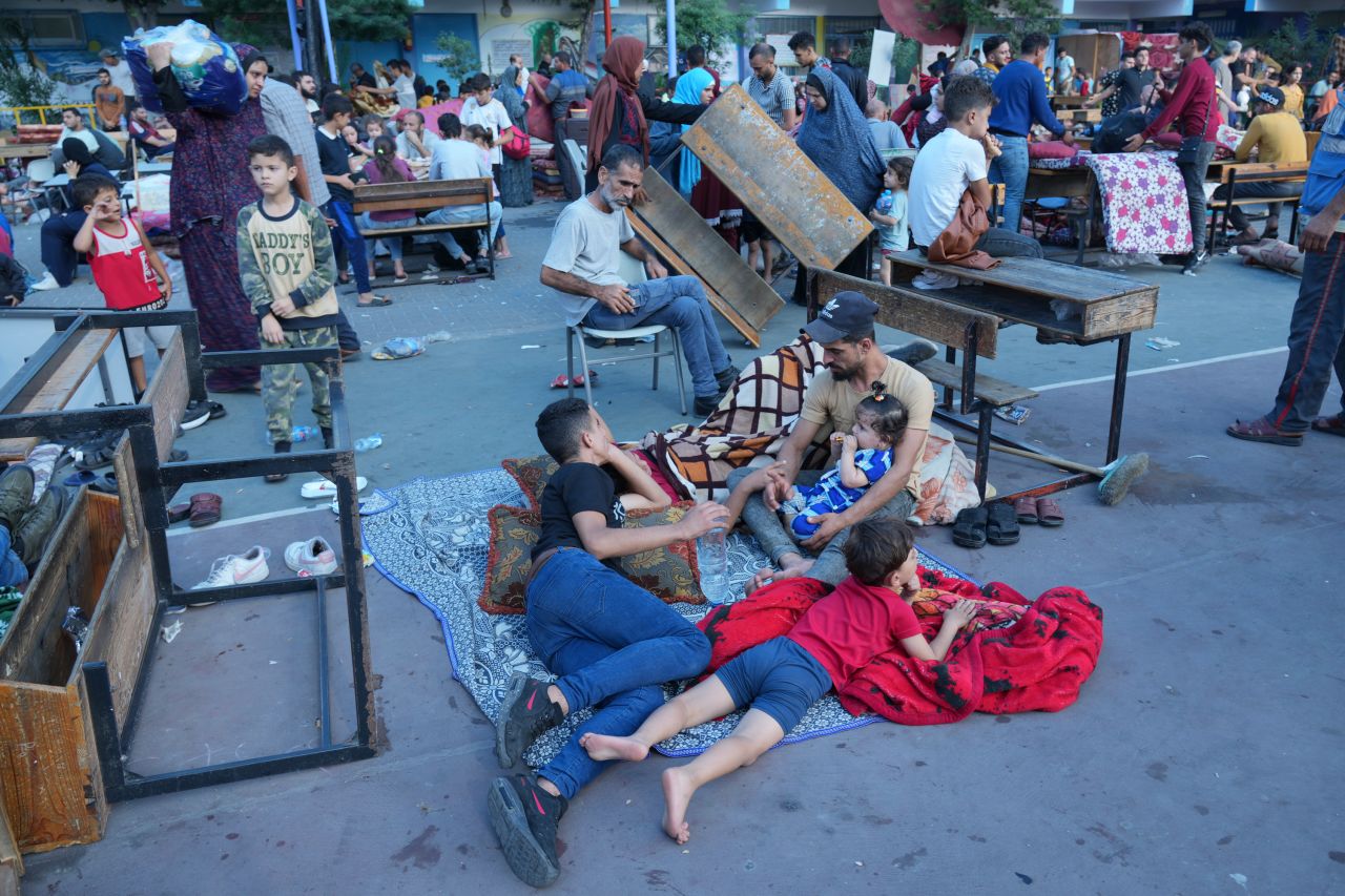 Palestinians take shelter in a U.N.-run school from the ongoing Israeli strikes on Gaza, in Nuiserat refugee camp, on October 14, 2023.