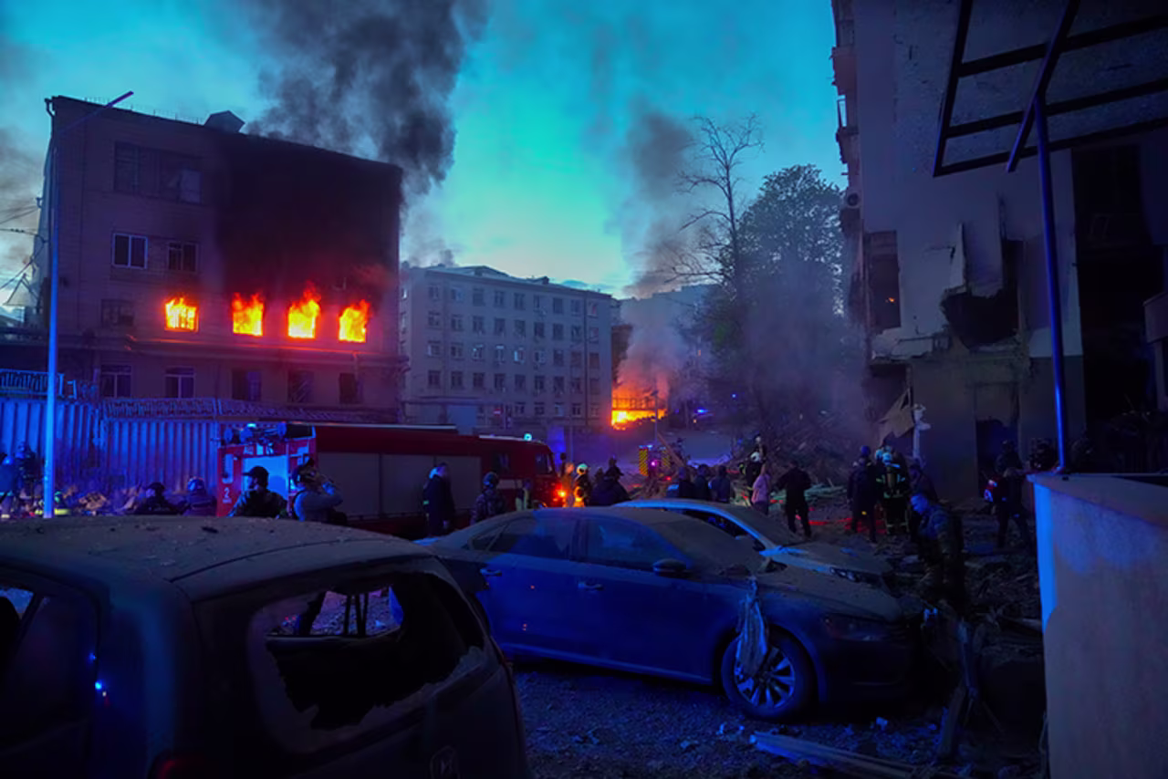 Firefighters put out a fire after a Russian rocket attack in Kyiv, Ukraine, Thursday, April 28. Russia mounted attacks across a wide area of Ukraine on Thursday, bombarding Kyiv during a visit by the head of the United Nations. 