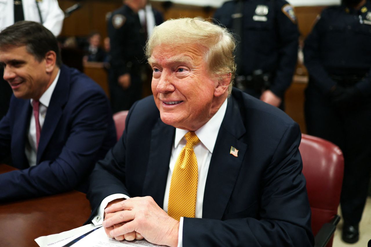 Former President Donald Trump smiles ahead of proceedings in his criminal trial at Manhattan Criminal Court in New York City, on May 29.