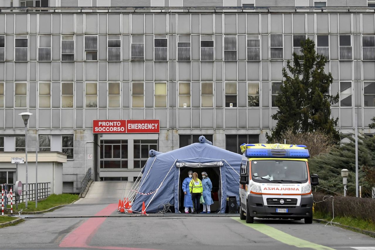 Paramedics stand by a tent that was set up outside the emergency ward of the Cremona hospital in northern Italy, on February 29.