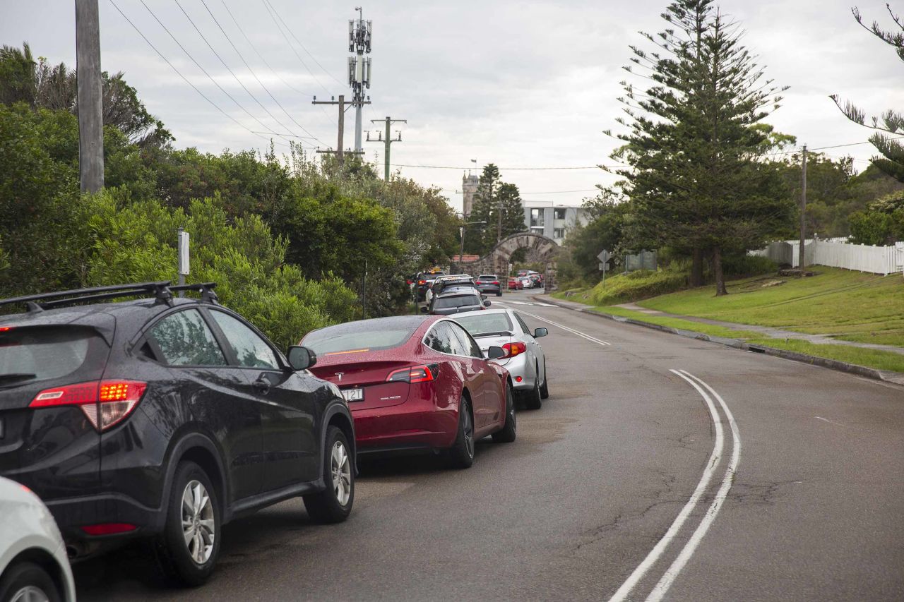 Cars are seen lining up at a Covid-19 testing clinic at the old Manly Hospital in Sydney, Australia, on December 18.