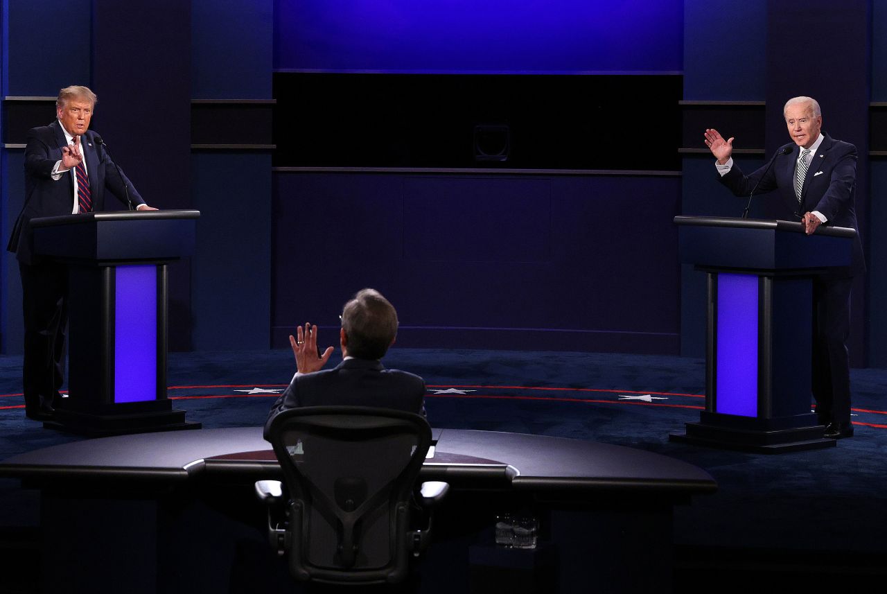 President Donald Trump, left, and Democratic nominee Joe Biden take part in the first presidential debate on September 29 in Cleveland. At center is moderator Chris Wallace.