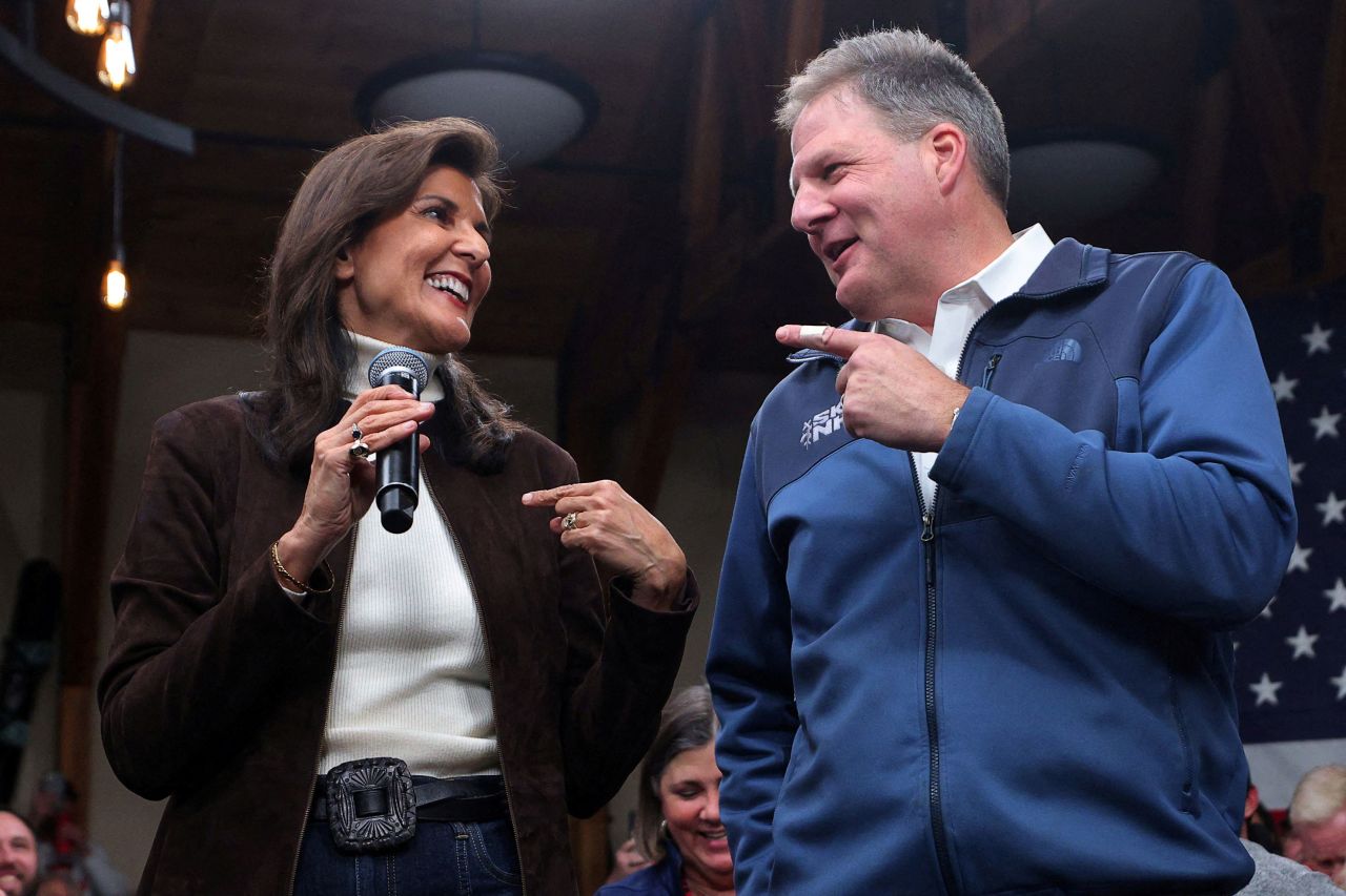 Nikki Haley speaks on stage with New Hampshire Gov. Chris Sununu at a campaign town hall in Manchester, New Hampshire, where Sununu announced his endorsement of Haley  on December 12.