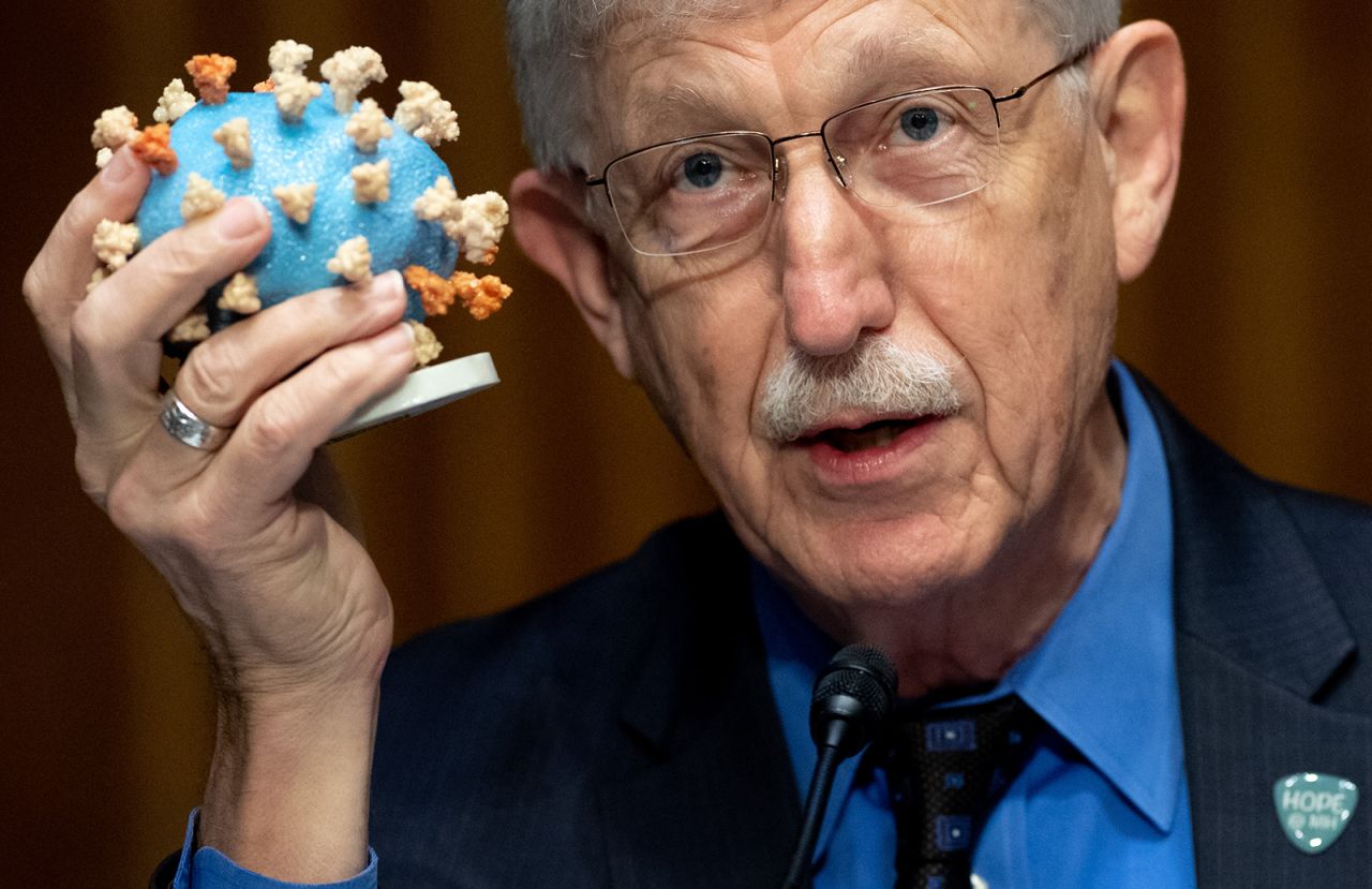 Dr. Francis Collins, Director of the National Institutes of Health (NIH), holds up a model of the coronavirus during a US Senate Appropriations subcommittee hearing on Operation Warp Speed on July 2 on Capitol Hill in Washington.