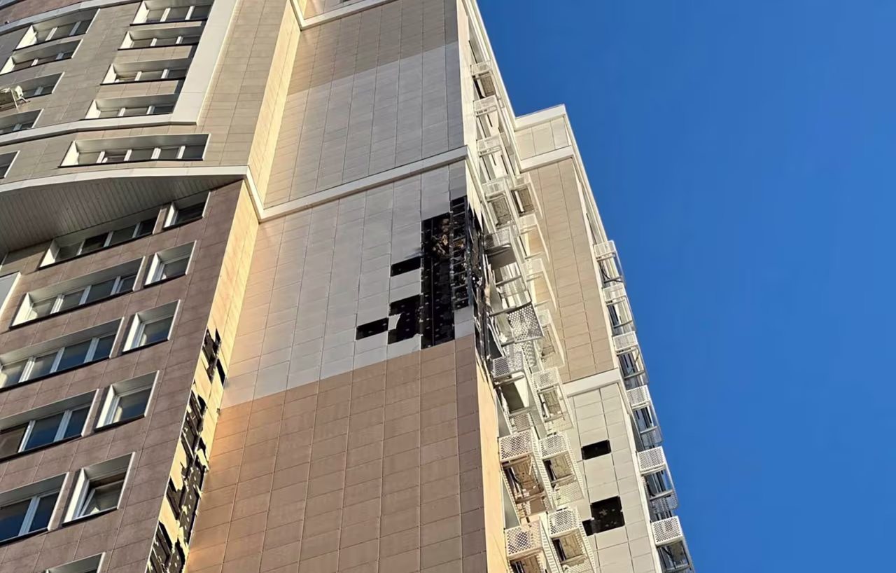 An apartment building that was damaged, according to local authorities, in a suspected drone attack in Belgorod, Russia, on August 13. 