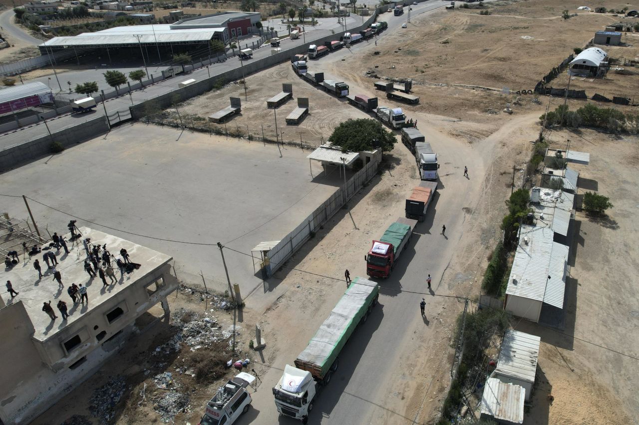 An aerial view shows a humanitarian aid convoy as it enters Gaza from Egypt via the Rafah border crossing on Saturday, October 21. 