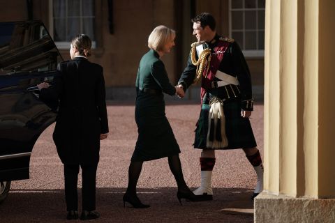 Britain's outgoing Prime Minister Liz Truss arrives at Buckingham Palace in London on Tuesday for an audience with King Charles III.