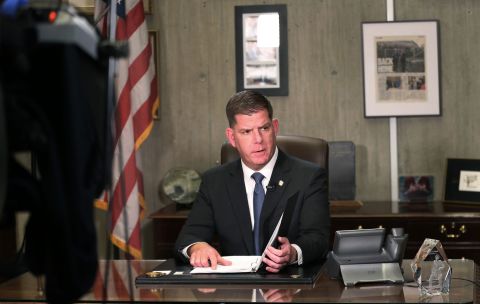 Boston Mayor Martin Walsh prepares to give a televised address from his office at Boston City Hall on March 17.