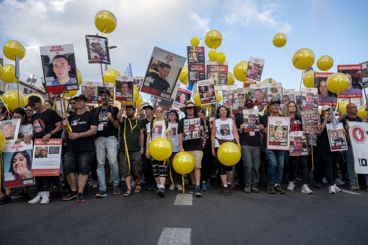 The families of the hostages and their supporters walk towards the prime minister's office on the fifth and final day of the March for the Hostages on November 18, in Jerusalem. 