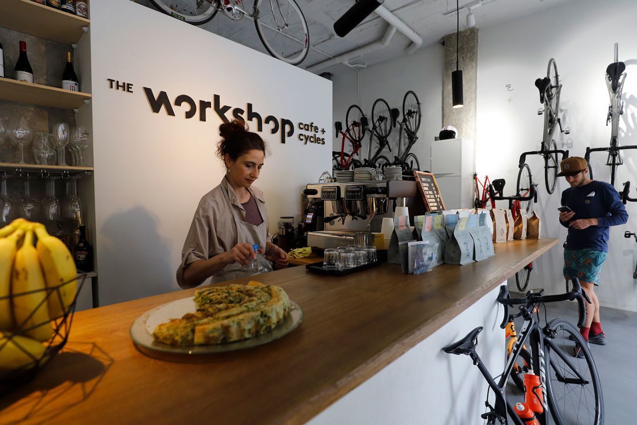 Employees at the Cafe + Cycles restaurant in Palm de Mallorca, Spain, prepare the interior for reopening.