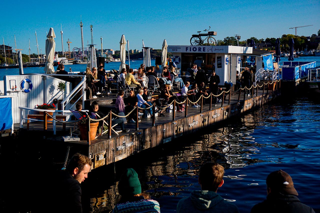 People eat at a bar in Stockholm on September 19.