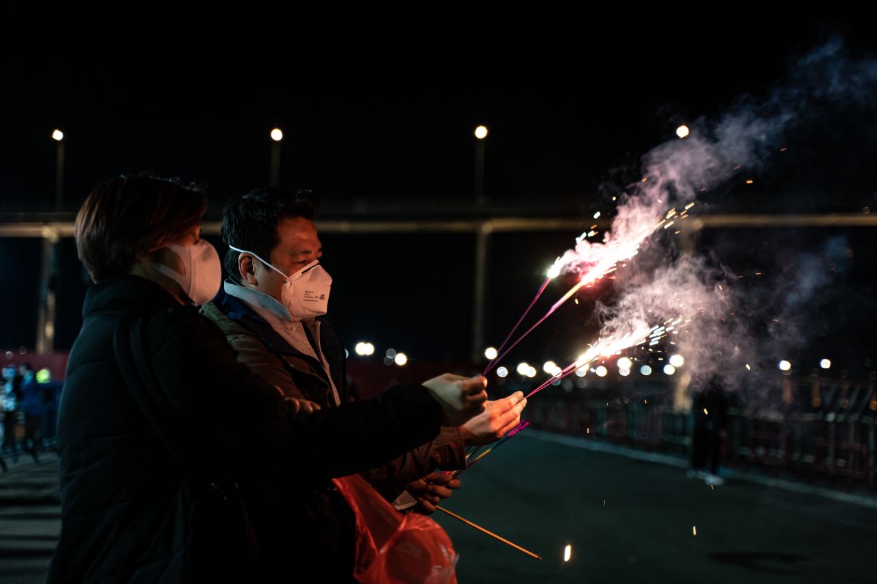 Macau residents wearing face masks celebrate Chinese New Year on January 28, 2020.