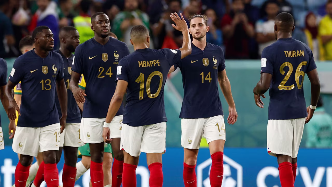France teammates celebrate after the match against Australia on November 22.