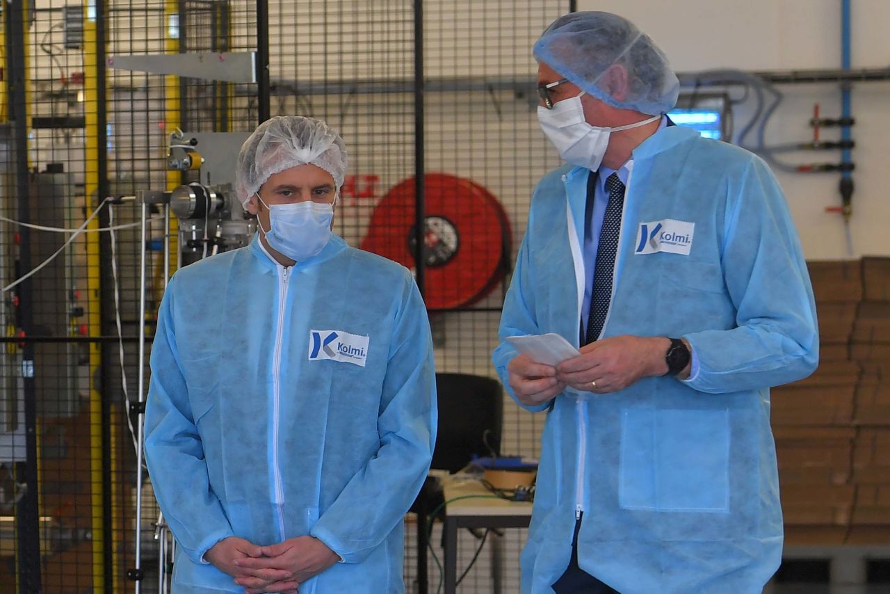 French President Emmanuel Macron, left, visits the Kolmi-Hopen protective face masks factory in Saint-Barthelemy-d'Anjou, France, on March 31.