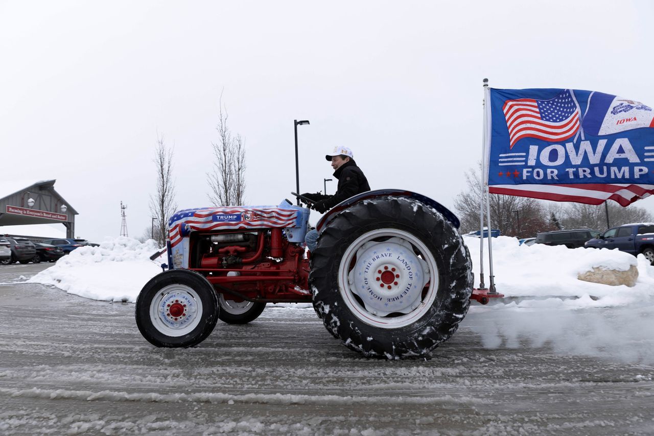 Gary Leffler drives his tractor outside of the Machine Shed Restaurant during an event for former President Donald Trump in Urbandale, Iowa, on January 11.