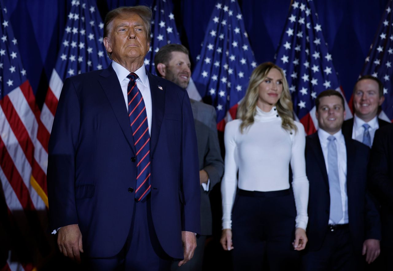 Former US President Donald Trump stands on stage during his primary night rally in Nashua, New Hampshire, on January 23.