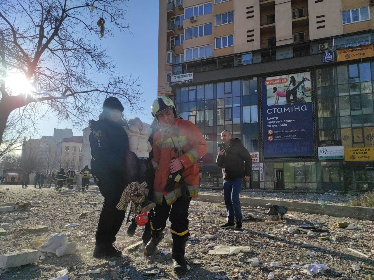 Residents being evacuated from damaged apartment building in Kyiv on February 26.