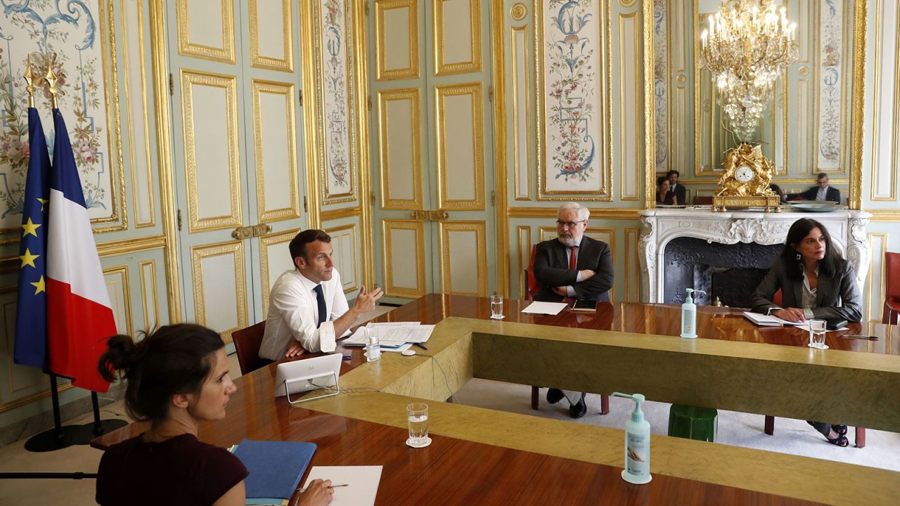 French President Emmanuel Macron attends a video conference call with the president of the Research and Expertise Analysis Committee on efforts to find a vaccine and treatment for Covid-19 at the Elysee Palace in Paris on April 16.