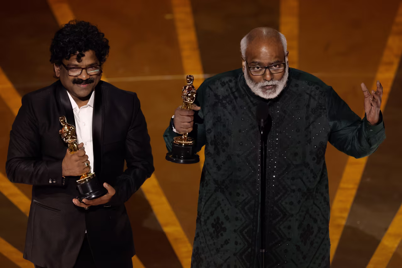 Chandrabose and M. M. Keervaani accept the best original song award for “Naatu Naatu.” 