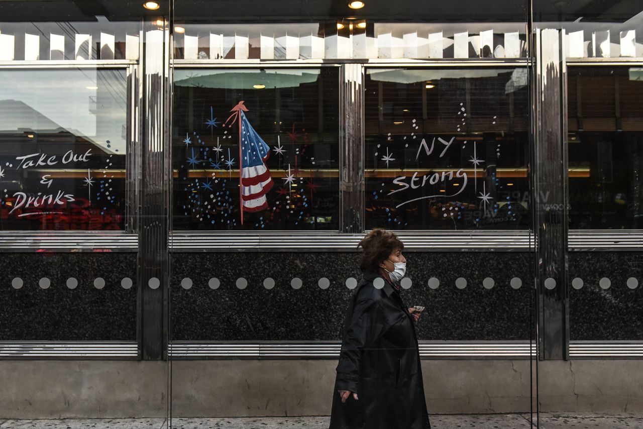 A person walks past the Bel Aire diner on May 20 in the Astoria neighborhood in the Queens borough in New York City. 