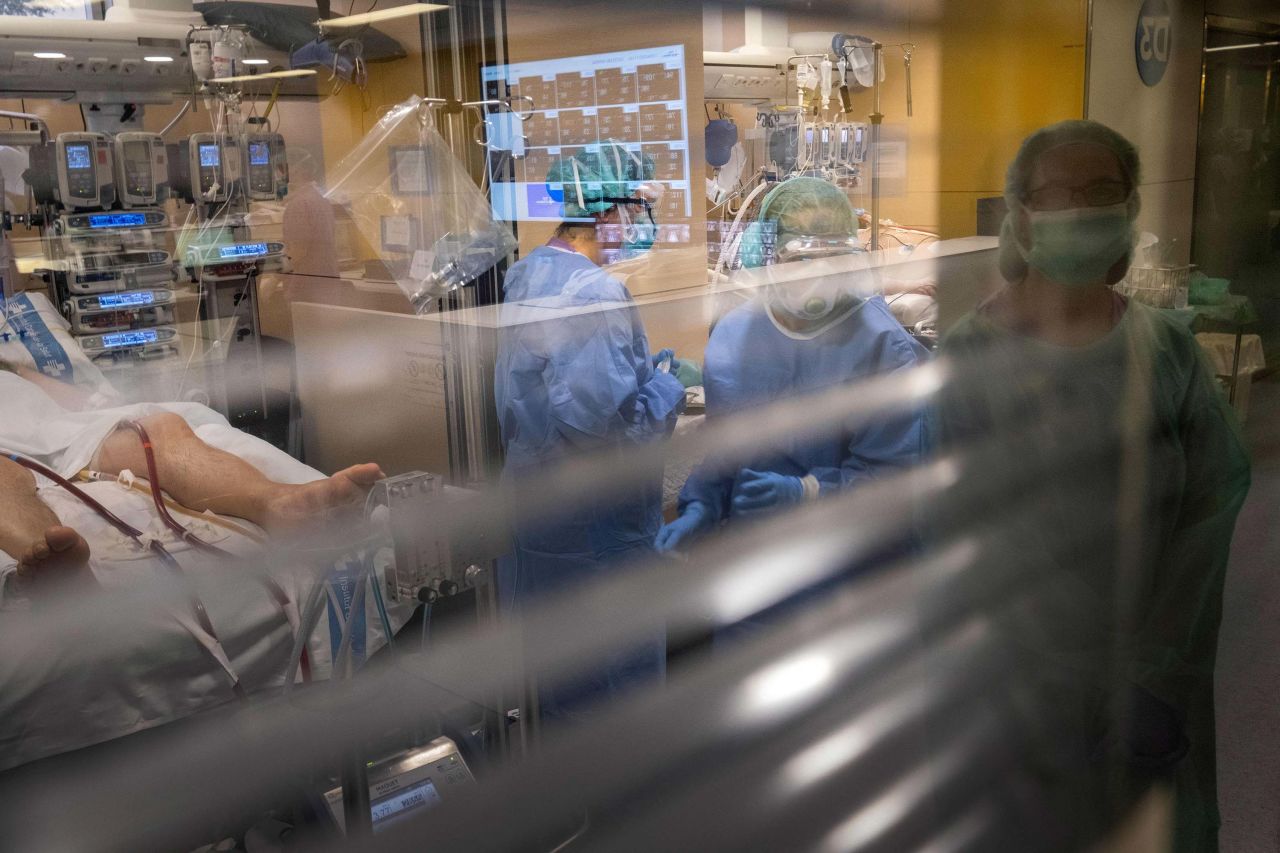 Health workers attend to a coronavirus patient in an intensive care unit at the Vall d'Hebron hospital in Barcelona, Spain, on April 1.