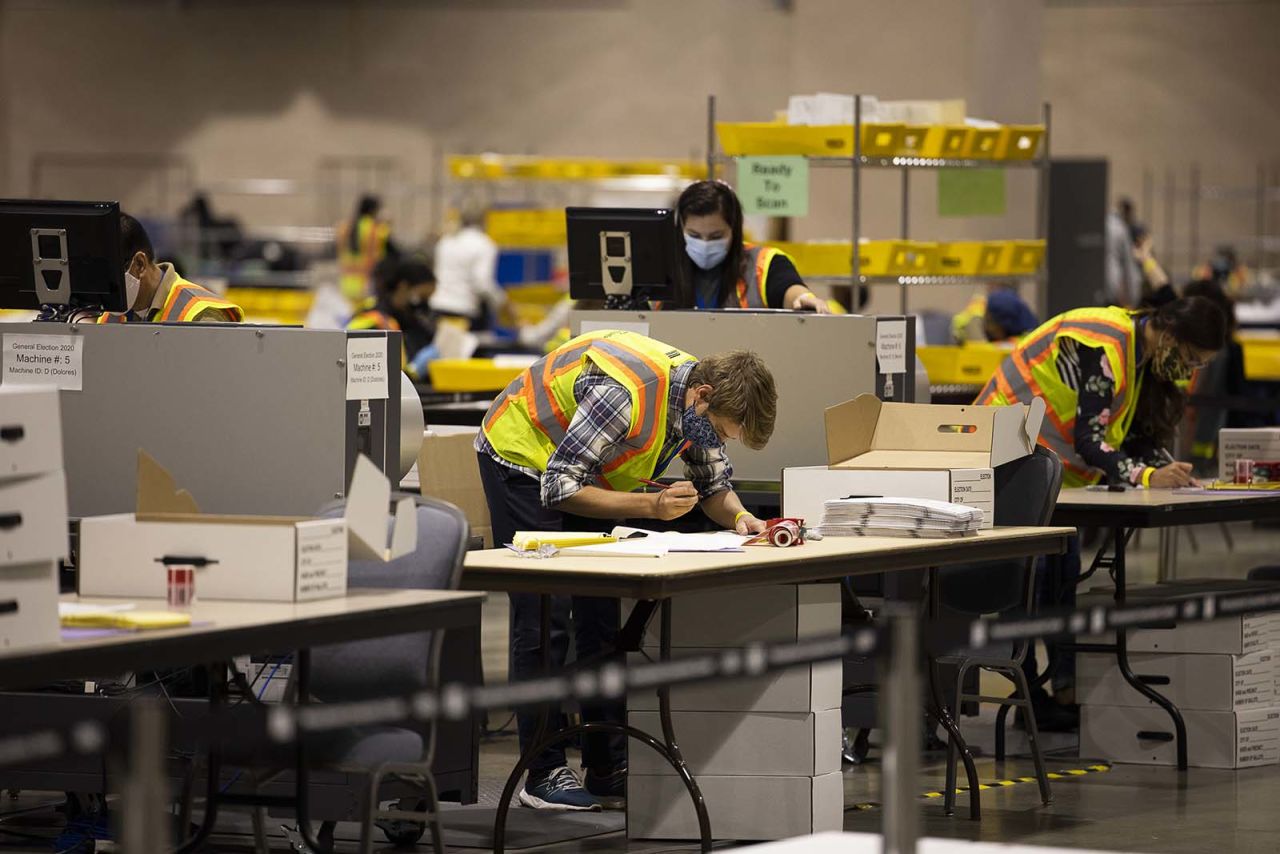 Workers for the City Commissioner's office count votes at a convention center in Philadelphia, Pennsylvania, on Wednesday, November 4.