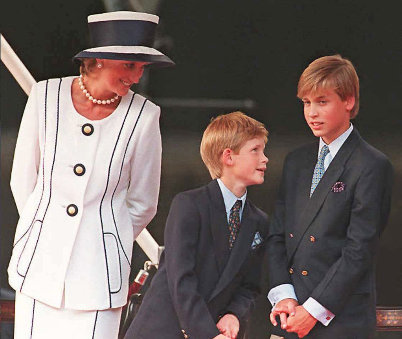 Princess Diana, Prince Harry, and Prince William gather for the commemorations of VJ Day, 19 August 1995, in London. 