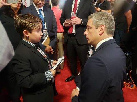 Rep. Tim Ryan talks to a young reporter in the spin room.