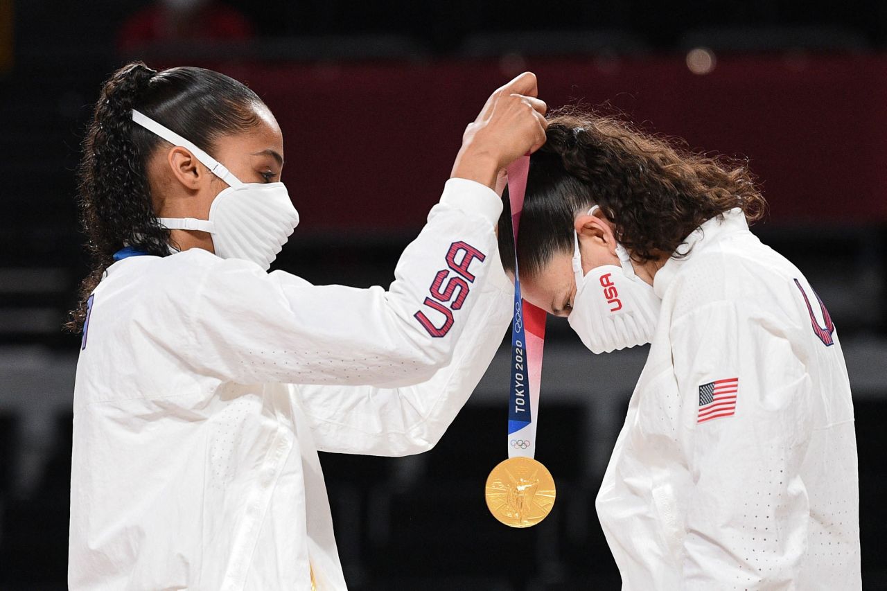USA's Skylar Diggins, left, puts a gold medal on teammate Sue Bird during the medal ceremony for the basketball competition on August 8.