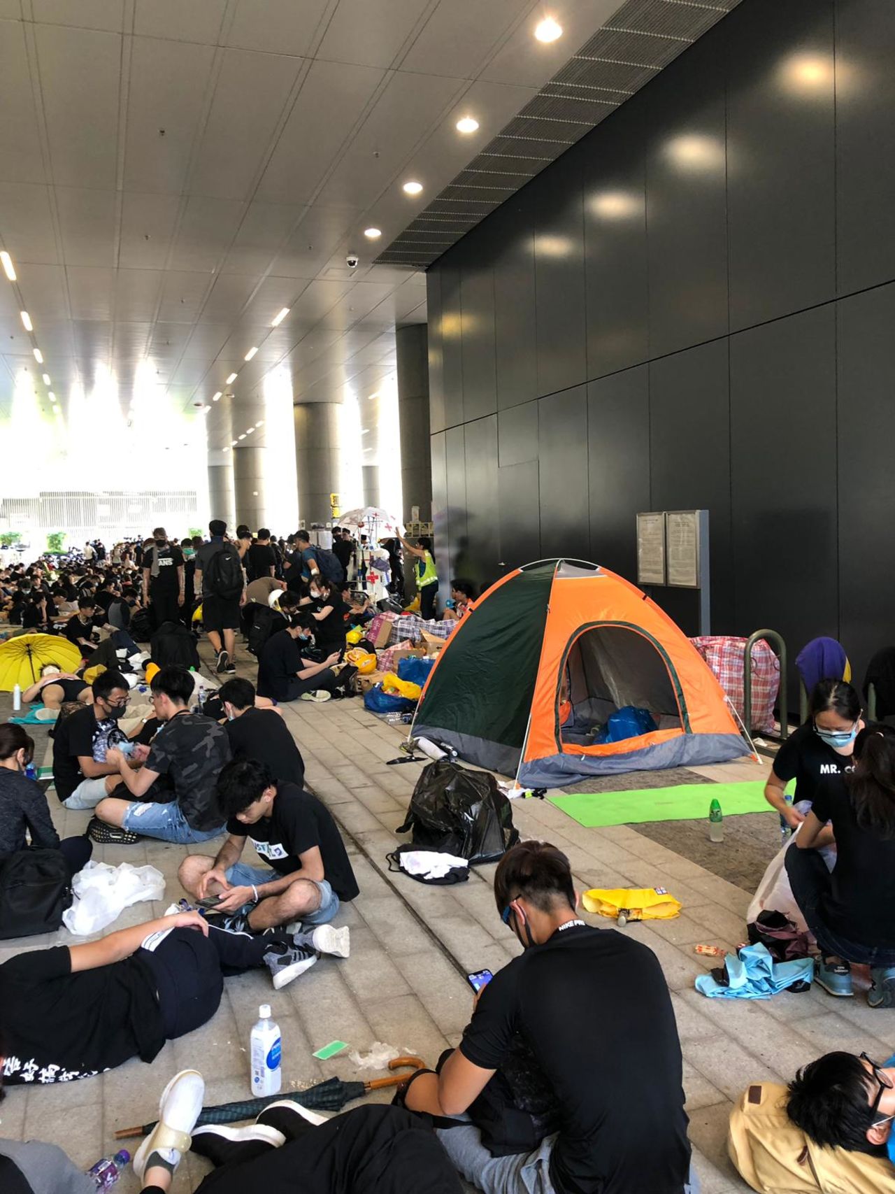 Protesters in Admiralty rest in tents and under building awnings to escape the heat.