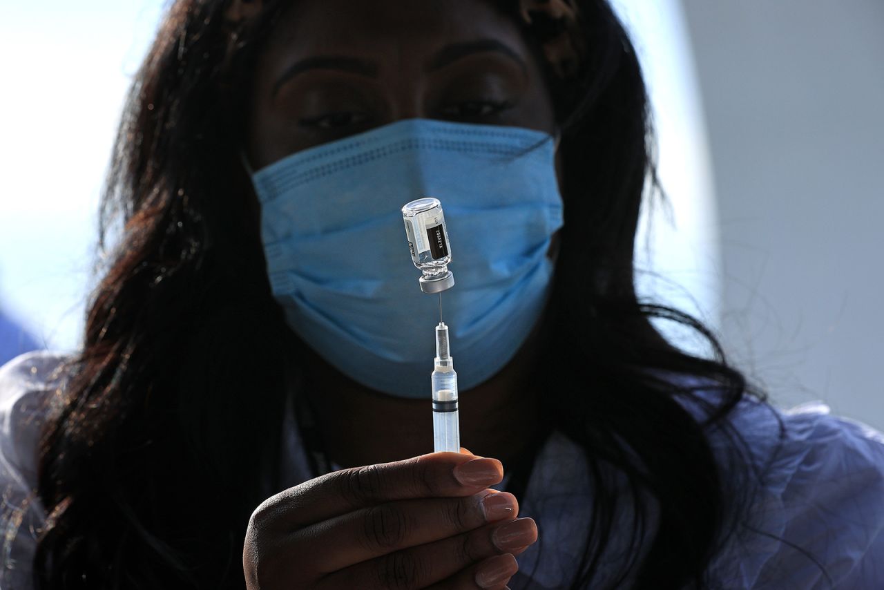 Health Nurse Manager Ashley Hennigan fills a syringe with a dose of the Johnson & Johnson coronavirus vaccine during a walk-up clinic at the John F. Kennedy Center for the Performing Arts' outdoor Reach area on May 6, in Washington, DC. 