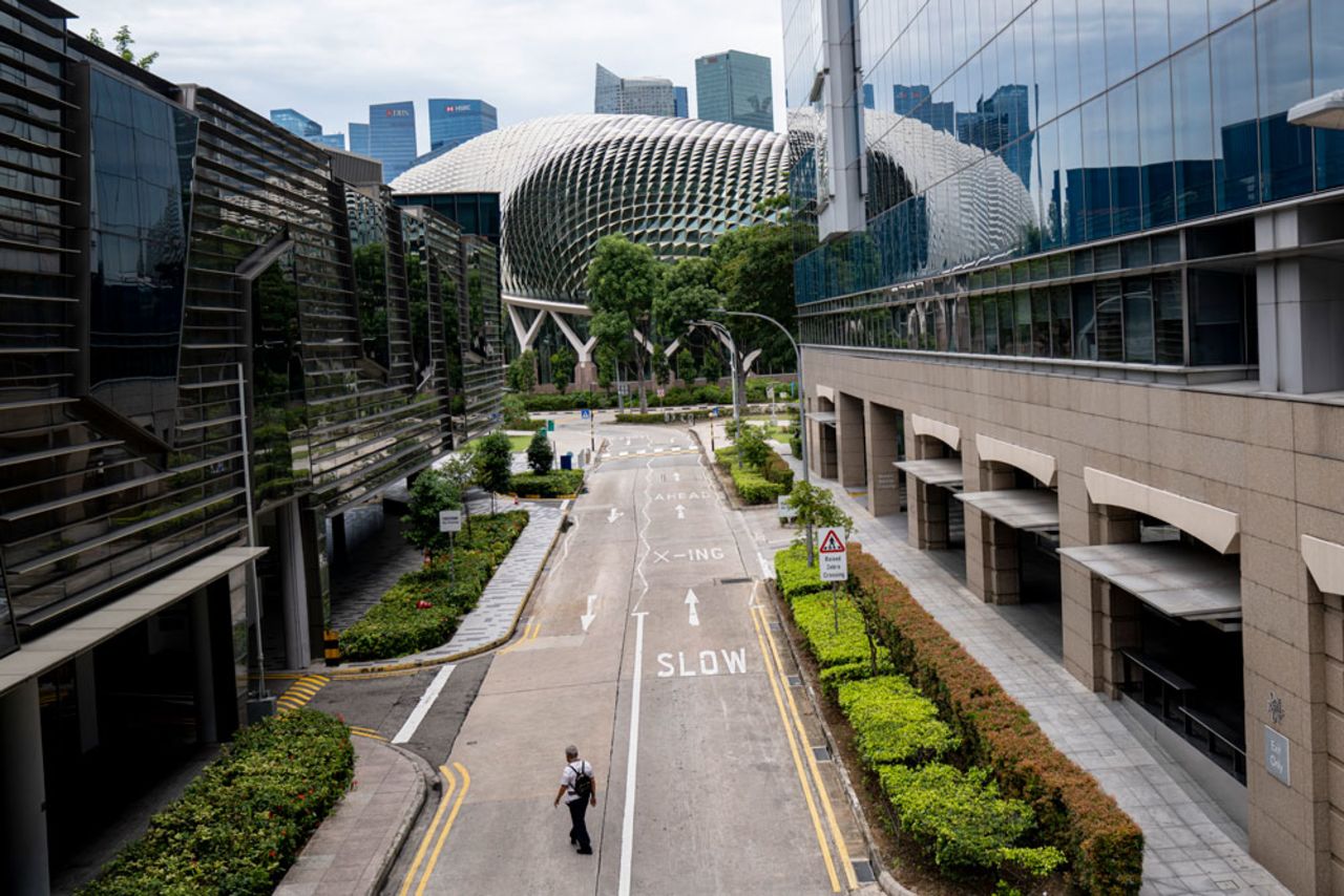 A man crosses an empty road in the Marina Bay area on April 7 in Singapore. 