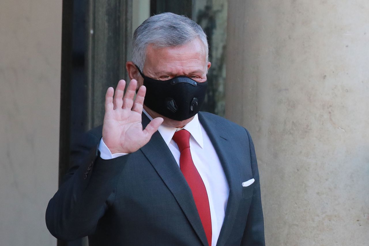 Jordan’s King Abdullah II waves prior to his meeting with French President Emmanuel Macron on September 8 in Paris.