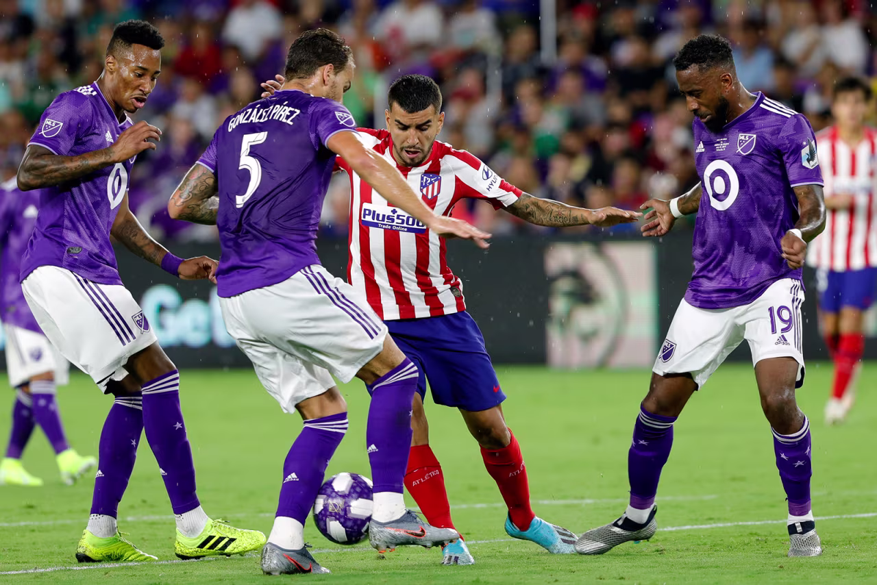 Leandro Gonzalez Pirez of MLS All-Stars and Angel Correa of Atletico de Madrid battle for the ball during the 2019 MLS All-Star Game between MLS All Stars and Atletico de Madrid at Exploria Stadium in Orlando, Florida on July 31, 2019.