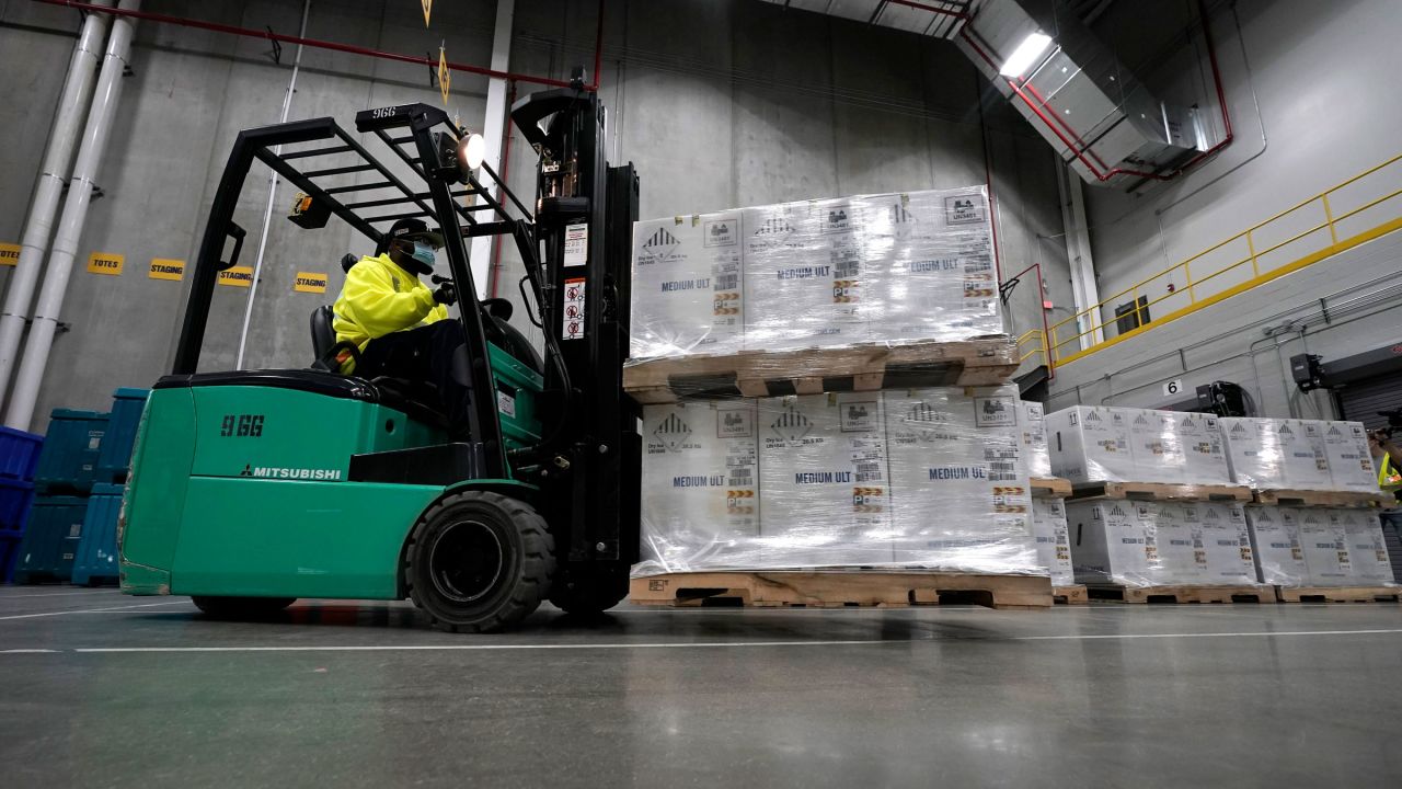 Boxes containing the Pfizer-BioNTech Covid-19 vaccine are prepared to be shipped from a manufacturing plant in Portage, Michigan, in December.
