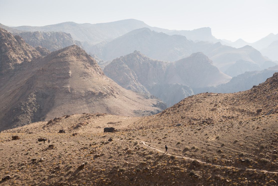 Hikers on a mountainous desert trail on the 650-kilometer Jordan Trail in Jordan.