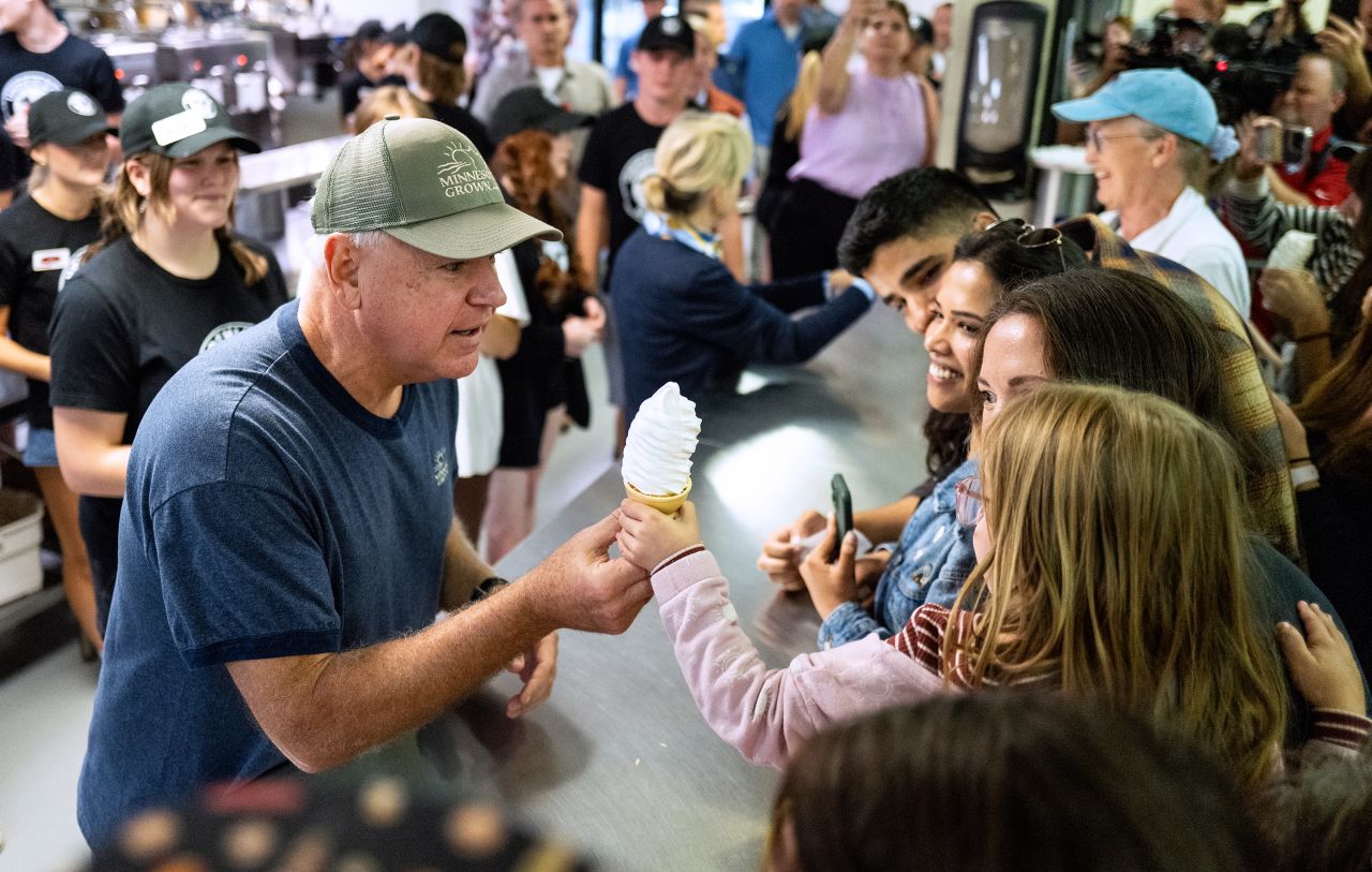 Gov. Tim Walz serves ice cream at the Minnesota State Fair in Falcon Heights on September 1.