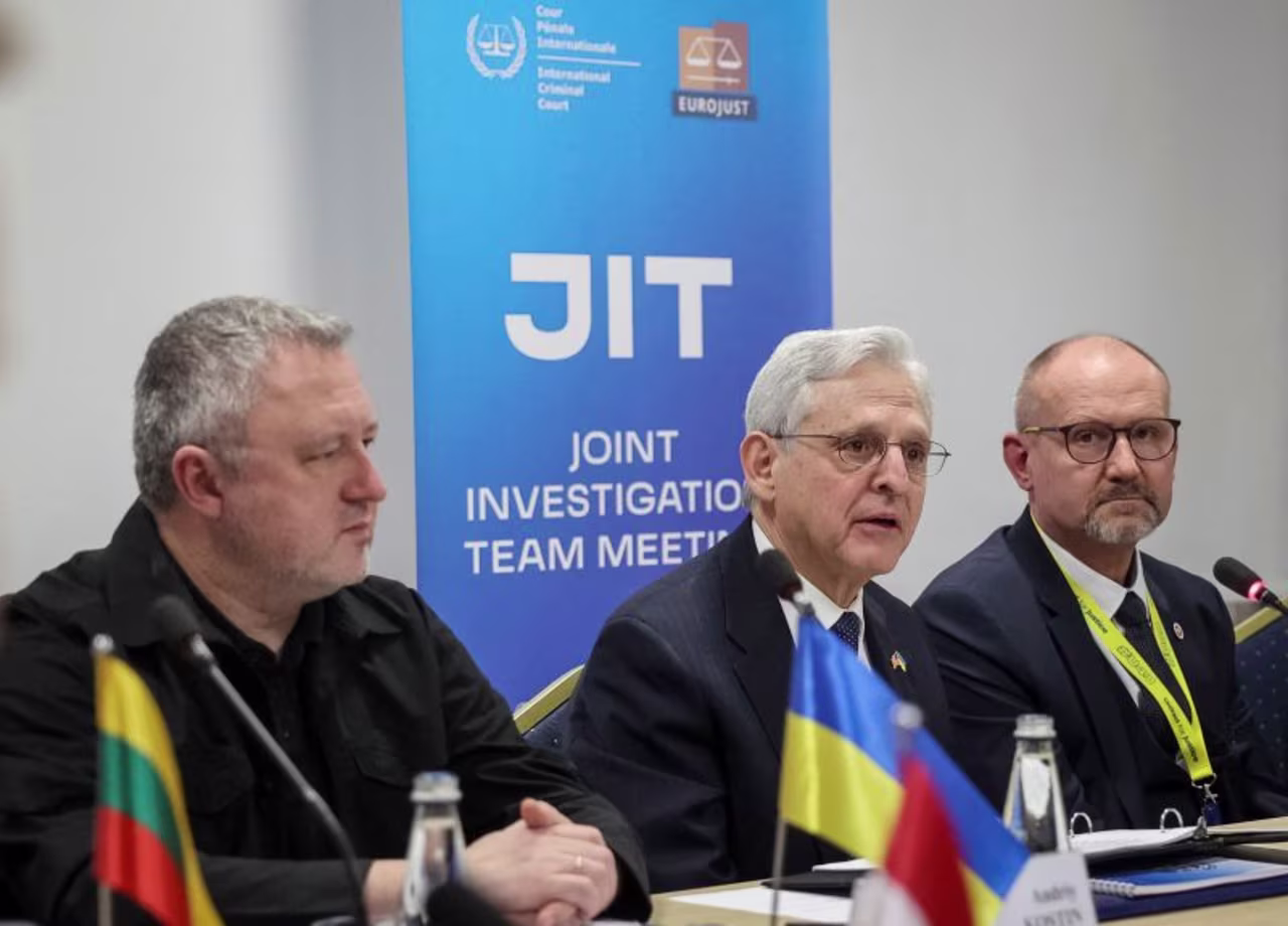 Left to right: Ukrainian Prosecutor General Andriy Kostin, US Attorney General Merrick Garland, and National Prosecutor of Poland Dariusz Barski meet in Lviv, Ukraine, with a group of international prosecutors on Friday.