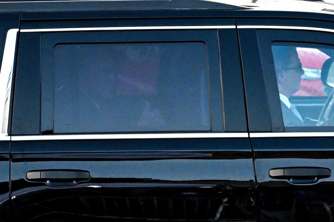 Former President Donald Trump gives a thumbs-up as he leaves the Fulton County jail in Atlanta on August 24. 