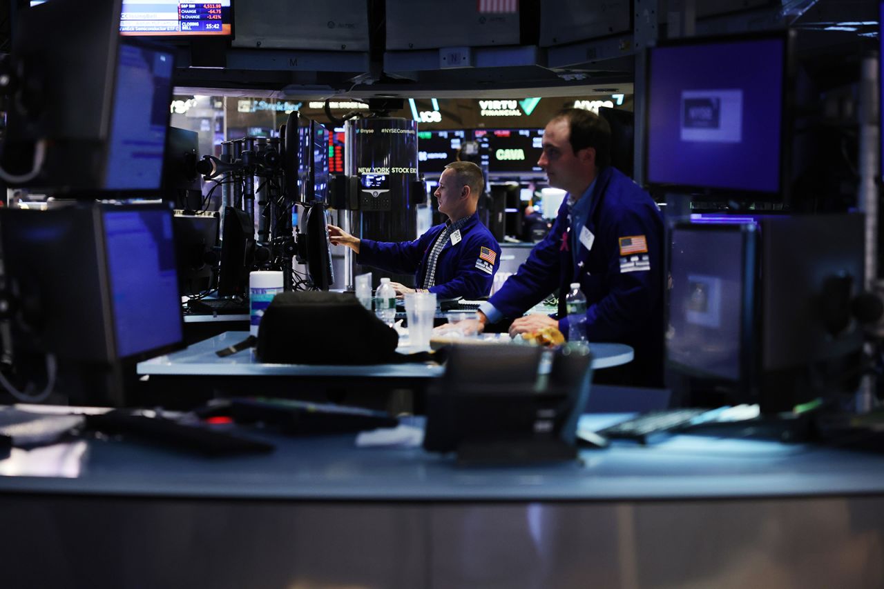 Traders work on the floor of the New York Stock Exchange on August 02.