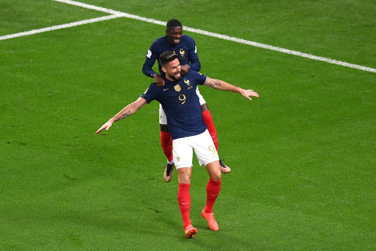 France's Olivier Giroud celebrates scoring a goal with their teammate Ousmane Dembele during a match against Australia on November 22.