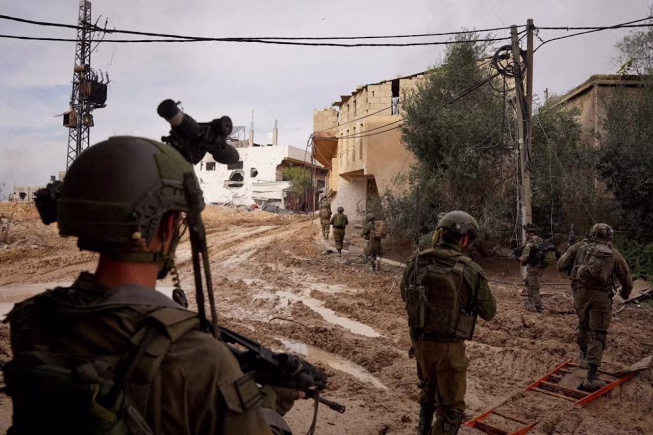 Israeli soldiers are seen in Khan Younis on December 24.