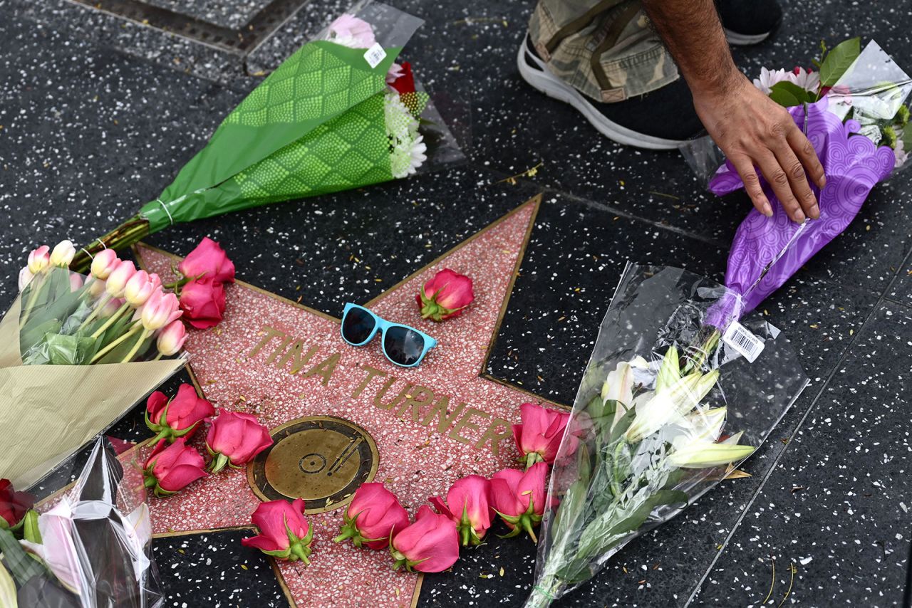 A person places flowers on Turner's star on the Hollywood Walk of Fame in Hollywood, California, on Wednesday, May 24. 