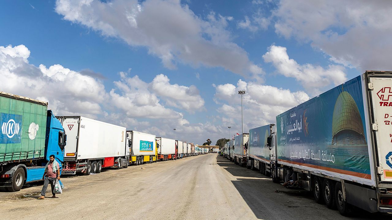 Trucks carrying supplies line up near the Rafah border on Wednesday, October 18, in North Sinai, Egypt.?