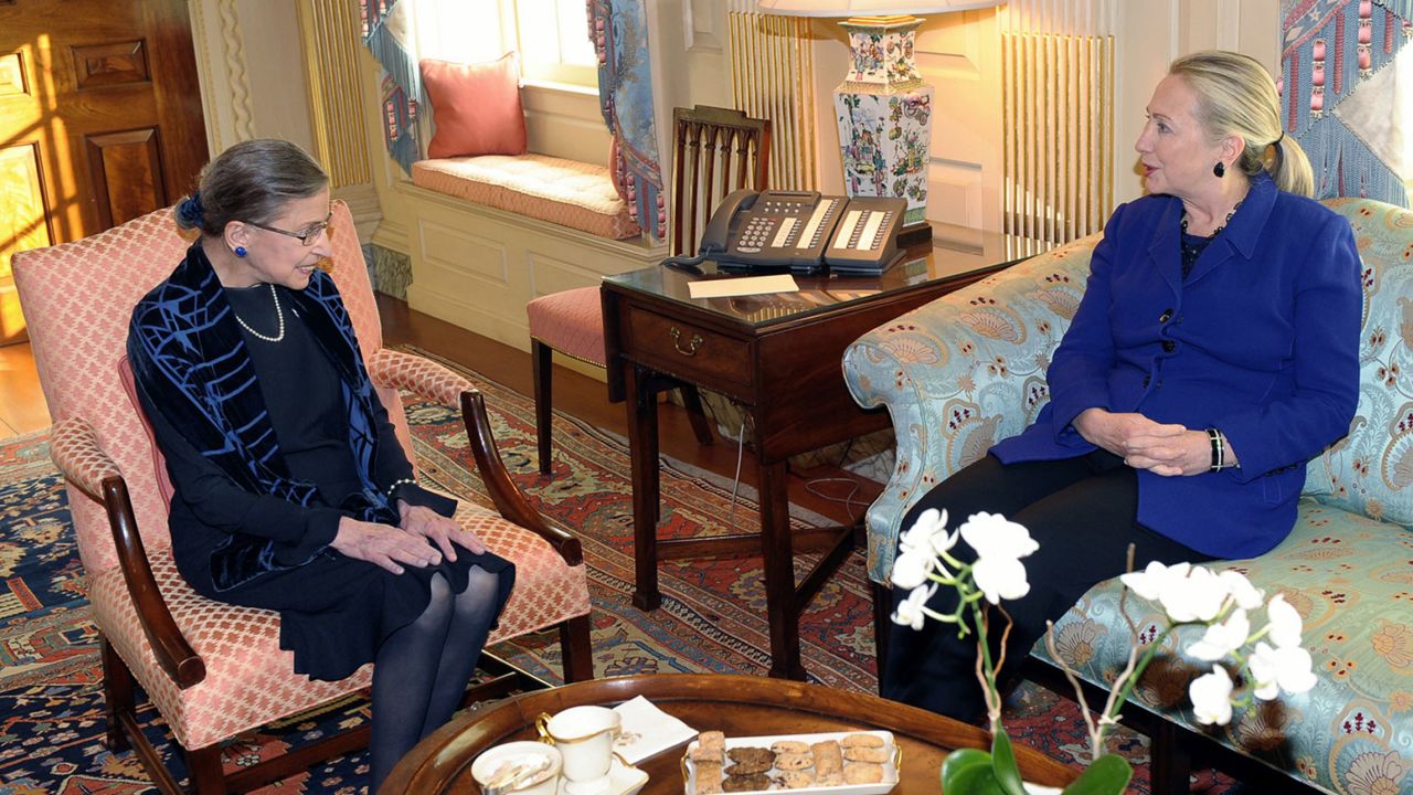 Ginsburg visits with Secretary of State Hillary Clinton at the State Department in Washington in 2012.